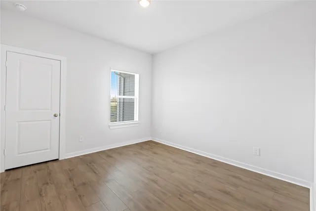 a view of a park with large trees