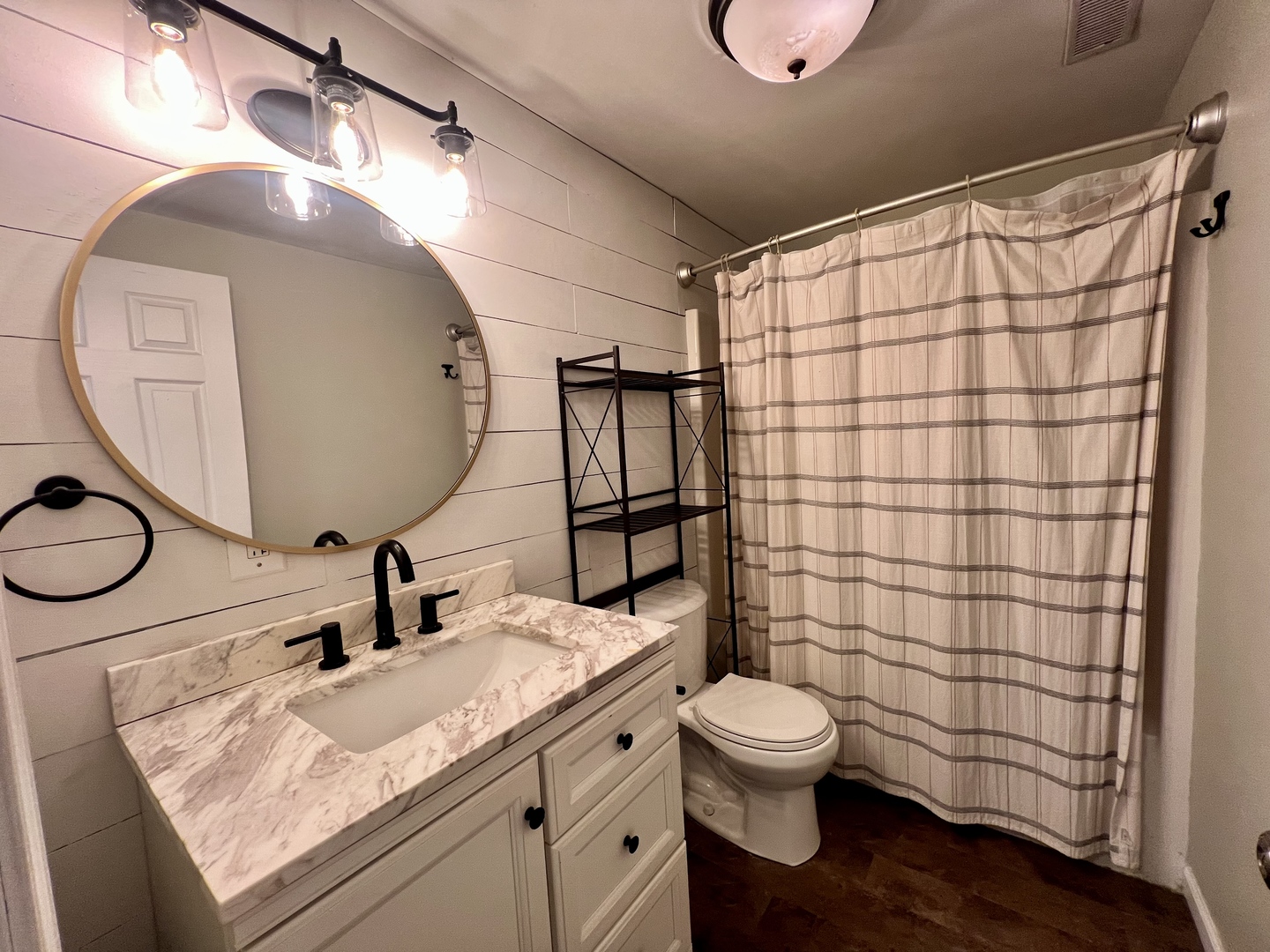 1410 South Mattis Avenue Champaign, IL 61821 - Photo 24 of 27 a bathroom with a granite countertop sink toilet a mirror and shower curtain