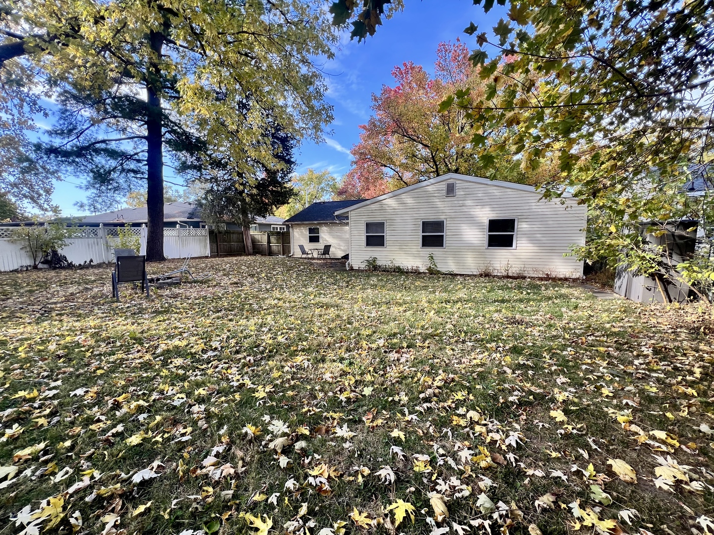 1410 South Mattis Avenue Champaign, IL 61821 - Photo 27 of 27 a white house that has a tree in front of it