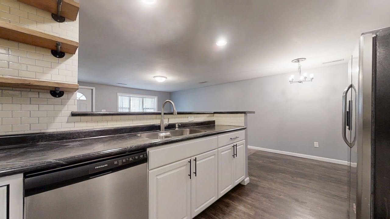 1410 South Mattis Avenue Champaign, IL 61821 - Photo 10 of 27 a kitchen with a sink and cabinets