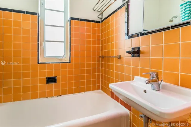 a bathroom with a white bath tub