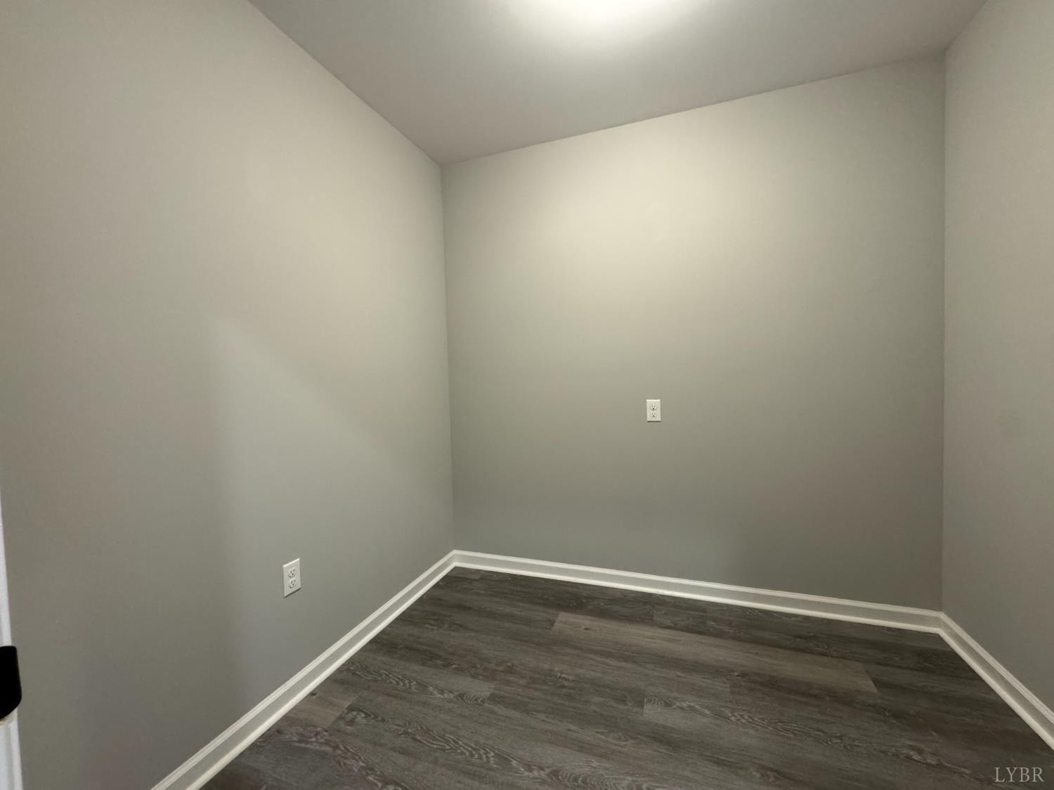 3941 Promise Land Road Appomattox, VA 24522 - Photo 12 of 21 a view of an empty room with wooden floor and white wall
