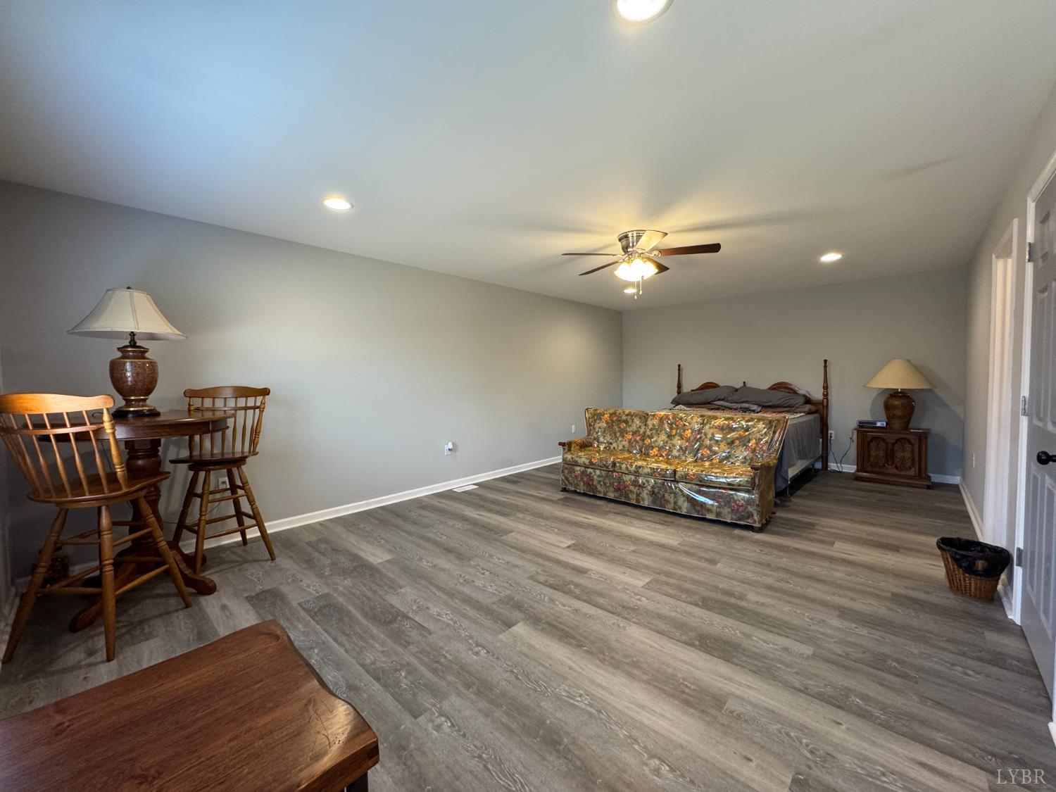 3941 Promise Land Road Appomattox, VA 24522 - Photo 13 of 21 a living room with furniture and a chandelier