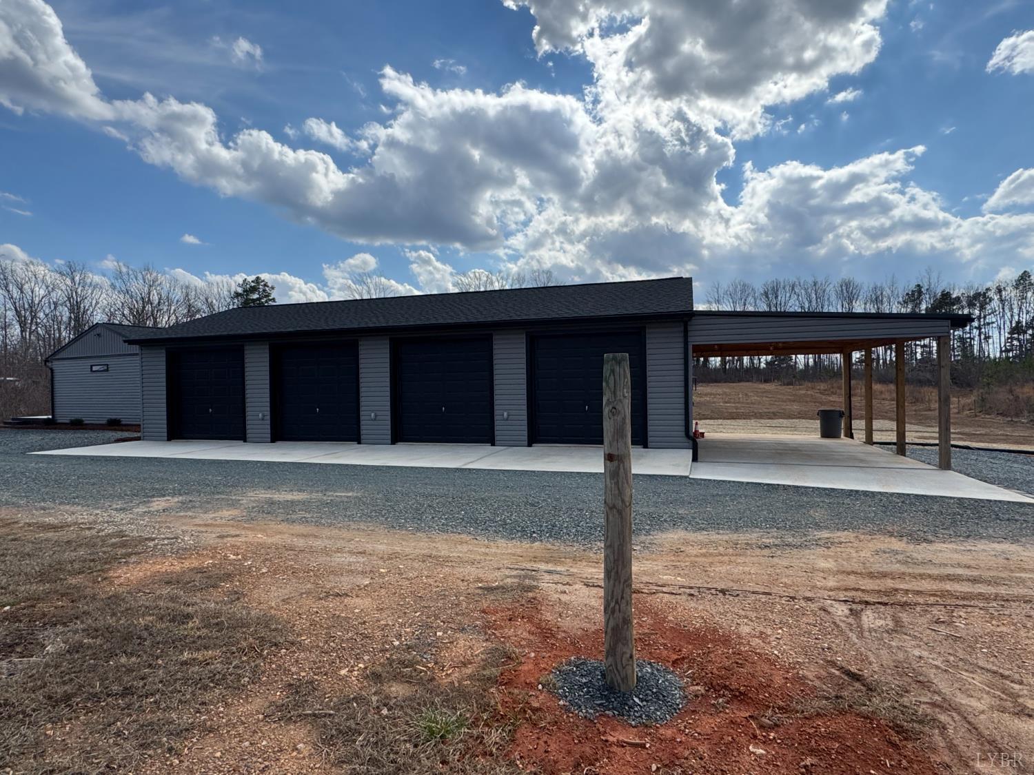 3941 Promise Land Road Appomattox, VA 24522 - Photo 17 of 21 a view of a house with a backyard and a large tree