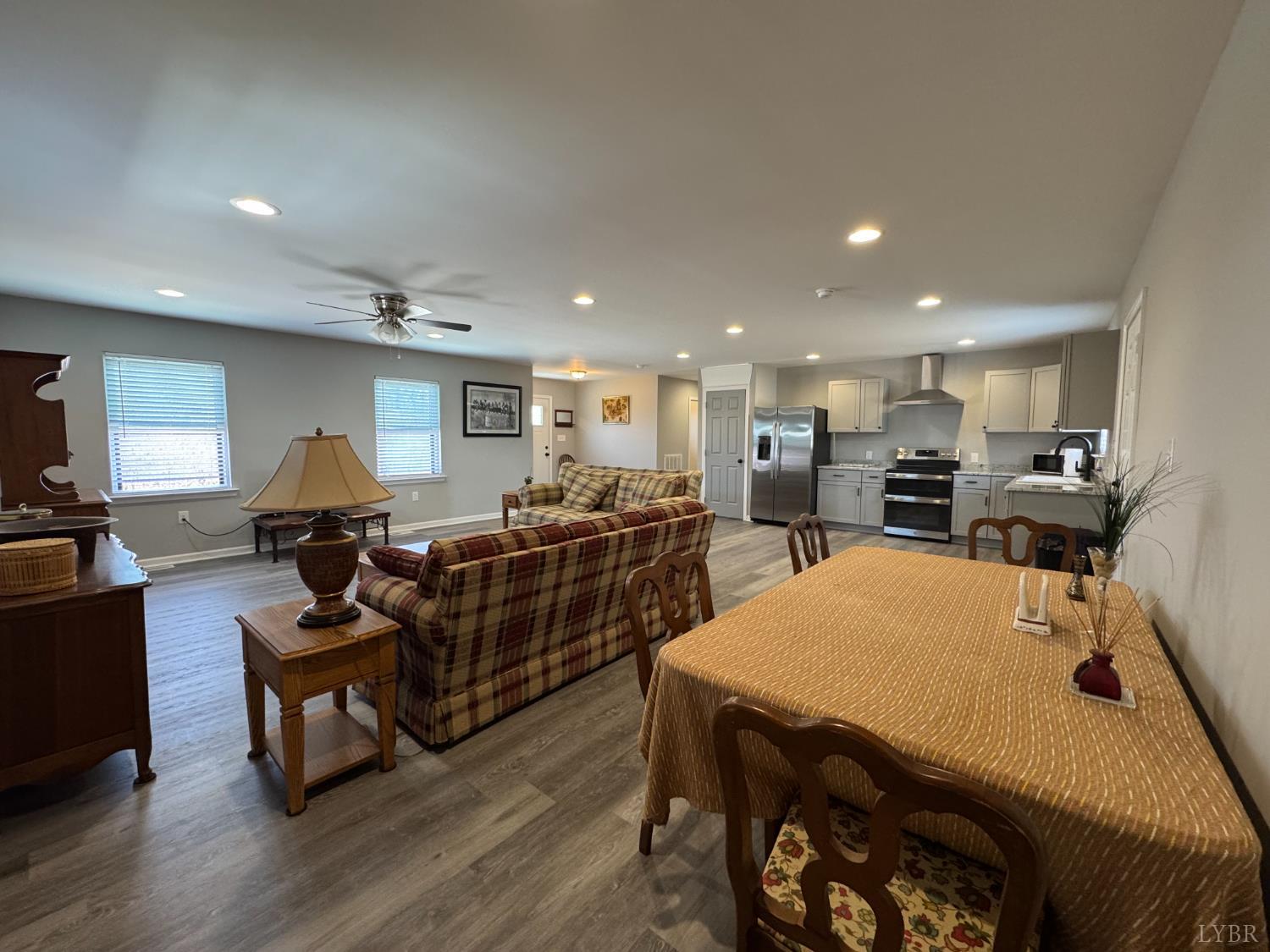 3941 Promise Land Road Appomattox, VA 24522 - Photo 6 of 21 a living room with furniture a wooden floor and kitchen view