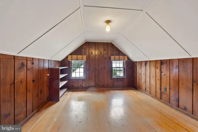 a view of a room with wooden walls