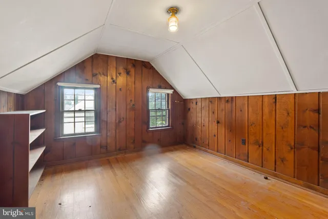 a view of a room with wooden walls