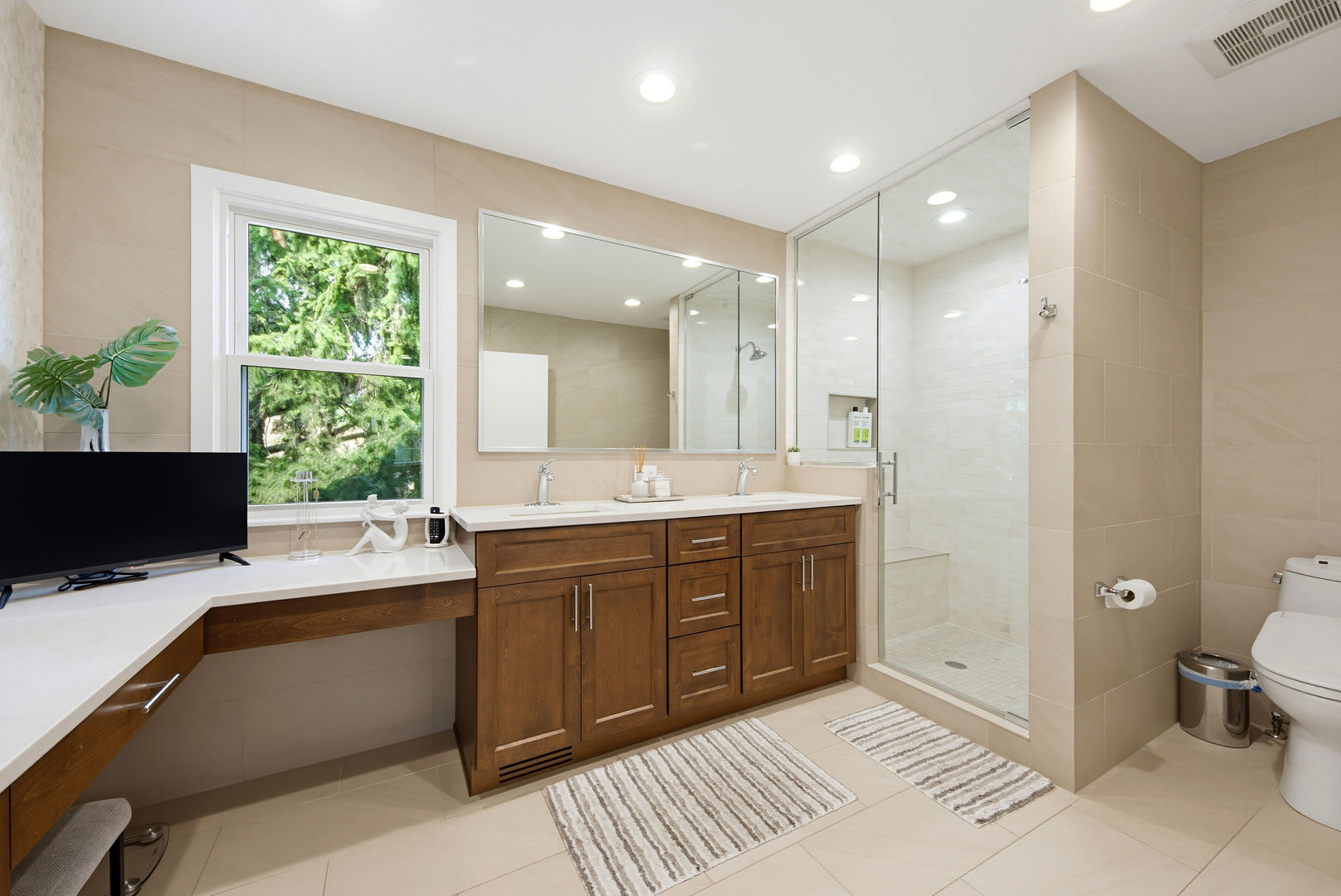 9200 Ridgeway Avenue Evanston, IL 60203 - Photo 18 of 33 a spacious bathroom with a double vanity sink a large mirror and a shower