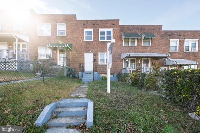 a backyard of a house with outdoor seating