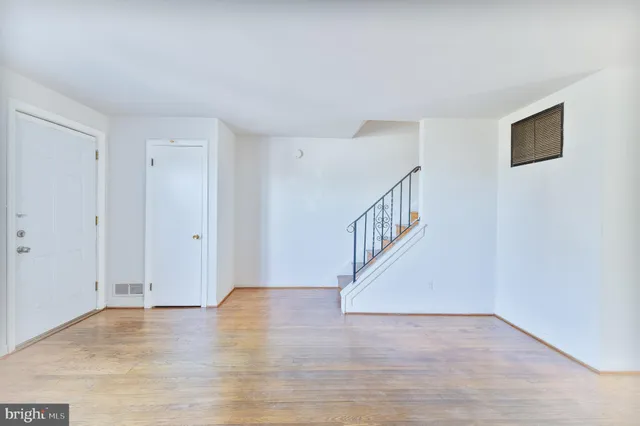 a view of an entryway with wooden floor