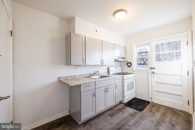 a kitchen with a sink and cabinets
