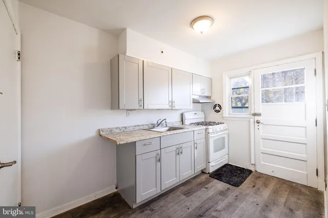 a kitchen with a sink and cabinets