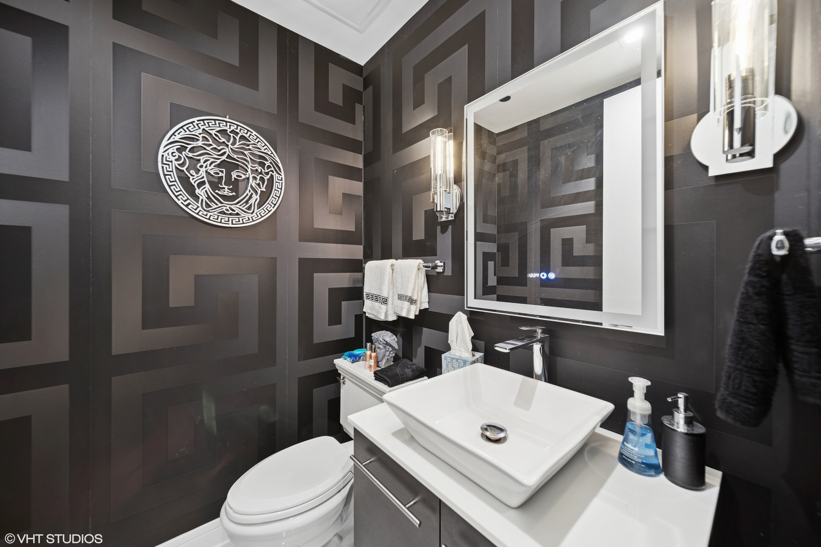 401 North Wabash Avenue, Unit 37C Chicago, IL 60611 - Photo 10 of 21 a bathroom with a toilet a sink and a mirror