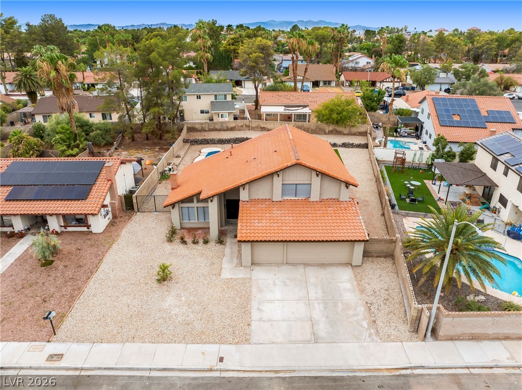 2411 Doherty Way Henderson, NV 89014 - Photo 34 of 34 An inviting family home with ample outdoor space and a private swimming pool, perfect for leisure.
