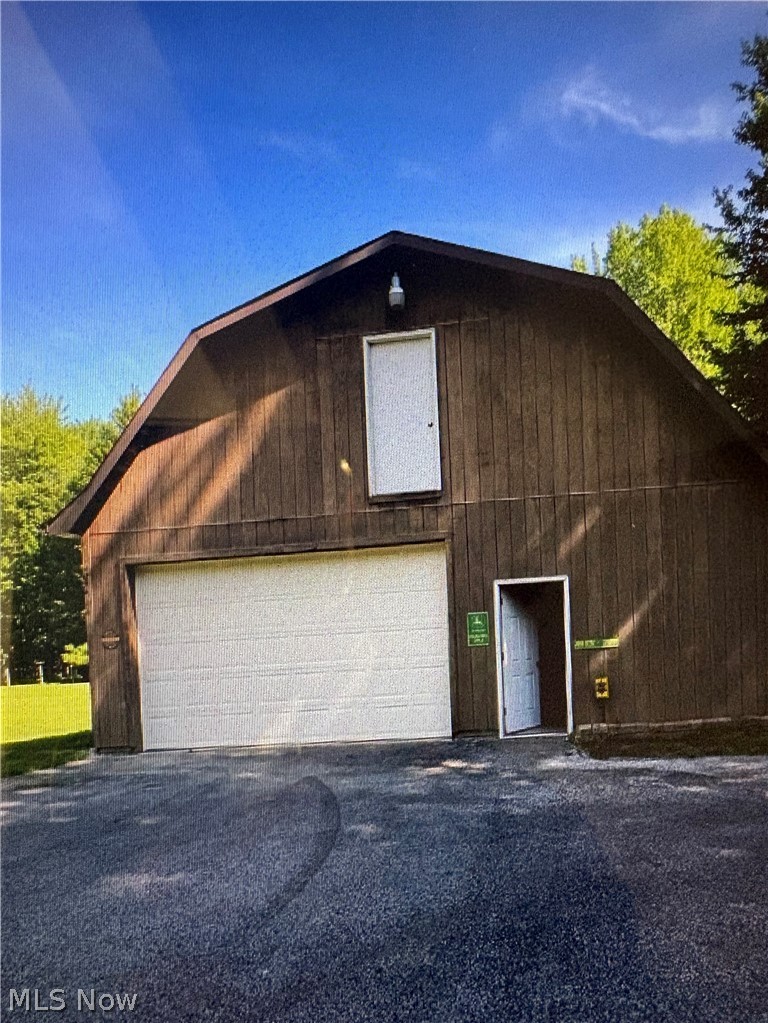 6475 Taylor Road Painesville, OH 44077 - Photo 19 of 23 2 of 2 out buildings w/16" garage doors, drive thru, 220 AMPs, w/water & concrete floor