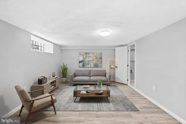 a living room with furniture and a rug