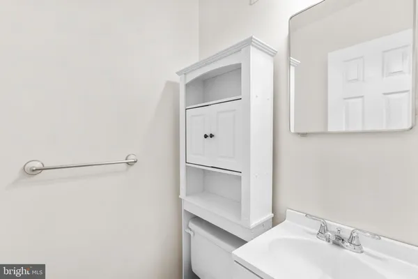 a bathroom with a sink and mirror