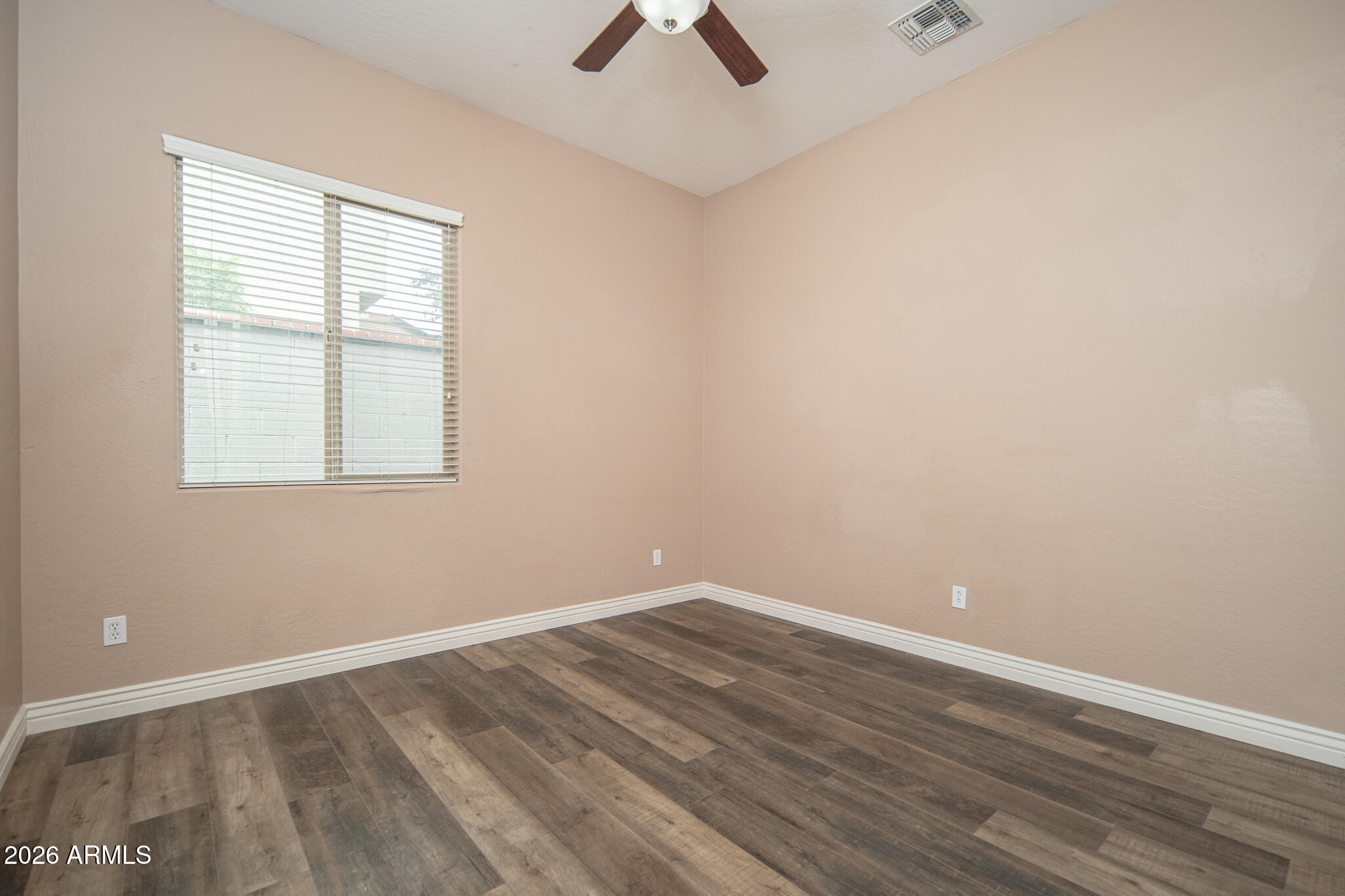 20377 West Shadow Street Buckeye, AZ 85396 - Photo 16 of 37 an empty room with a window and a ceiling fan
