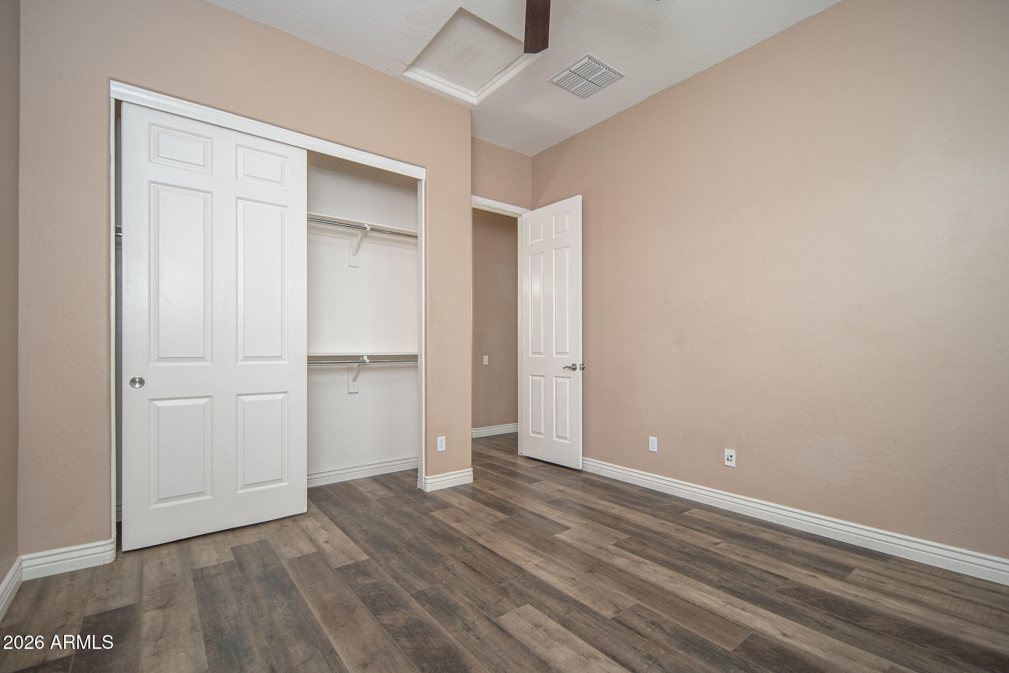20377 West Shadow Street Buckeye, AZ 85396 - Photo 17 of 37 a view of an empty room with wooden floor