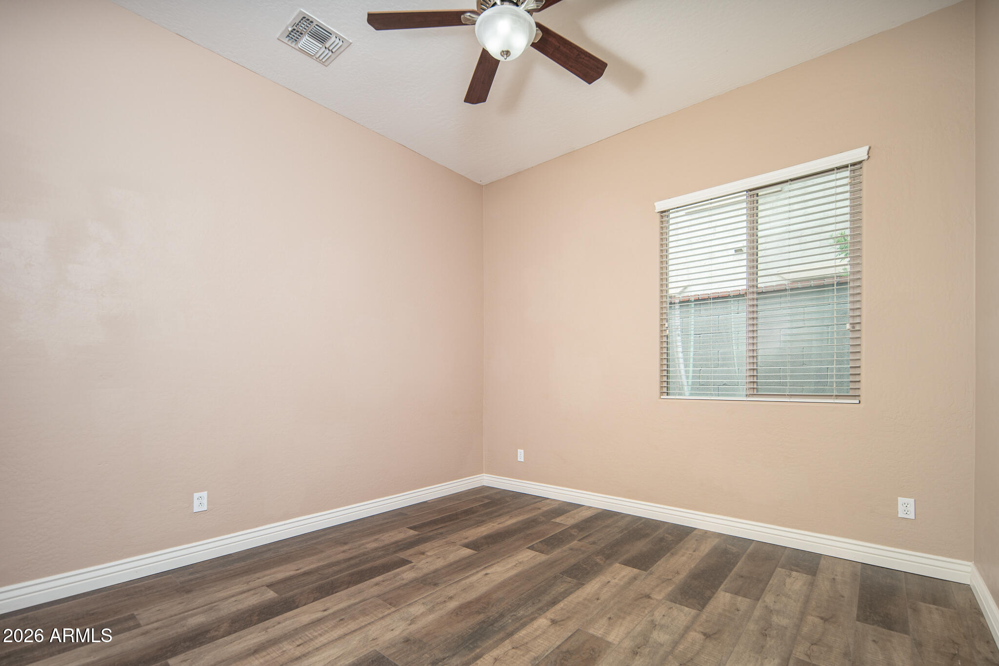 20377 West Shadow Street Buckeye, AZ 85396 - Photo 18 of 37 an empty room with a window and a fan
