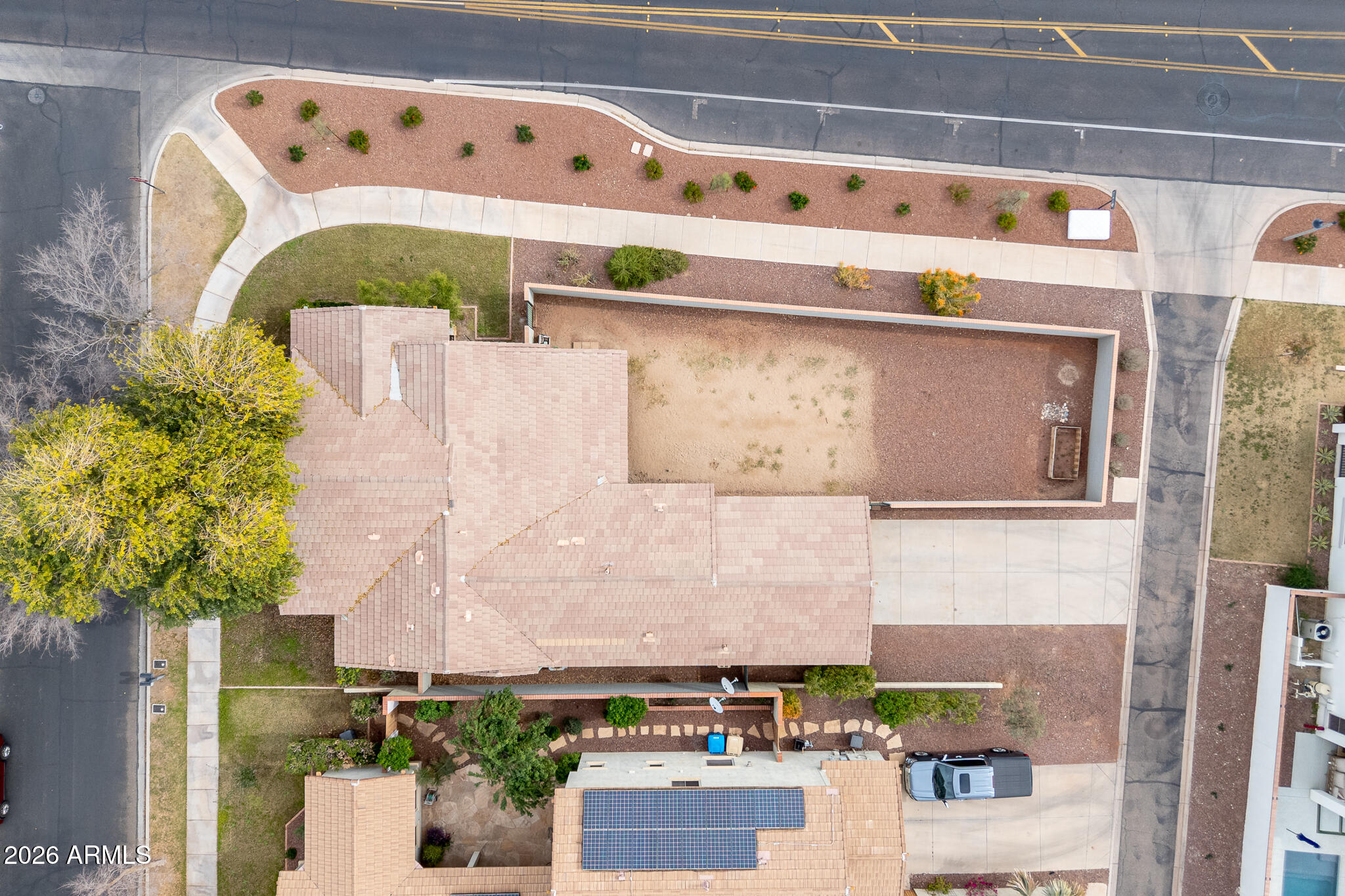 20377 West Shadow Street Buckeye, AZ 85396 - Photo 27 of 37 a white building with a potted plant in front of it