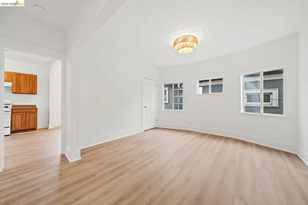 a view of an empty room and a window