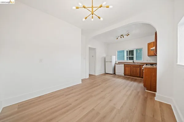 a view of a kitchen with a sink cabinets and wooden floor