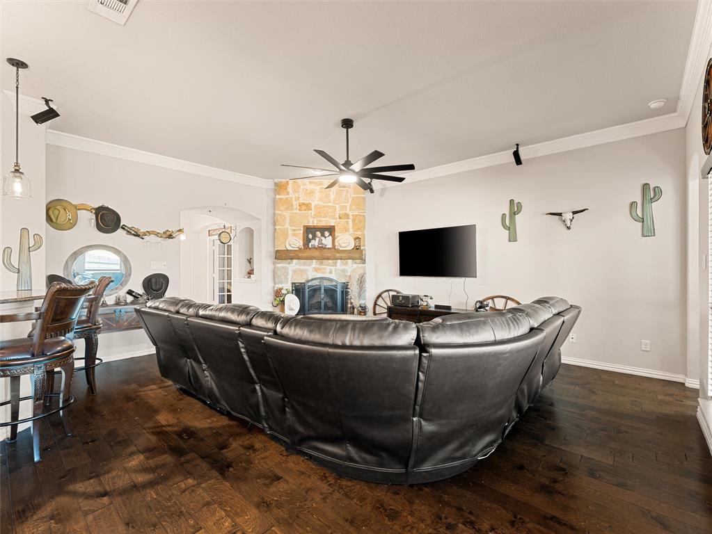 109 Highland Hills Boulevard Decatur, TX 76234 - Photo 12 of 36 a living room with furniture and a flat screen tv