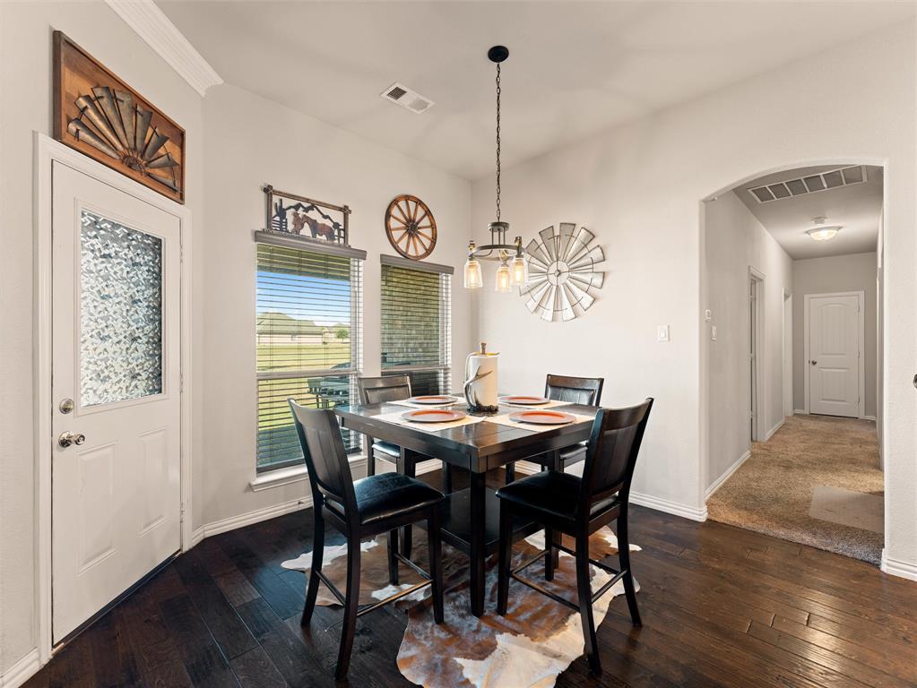 109 Highland Hills Boulevard Decatur, TX 76234 - Photo 16 of 36 a view of a dining room with furniture window and wooden floor