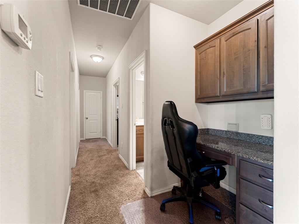 109 Highland Hills Boulevard Decatur, TX 76234 - Photo 22 of 36 a view of a workspace with furniture and wooden floor