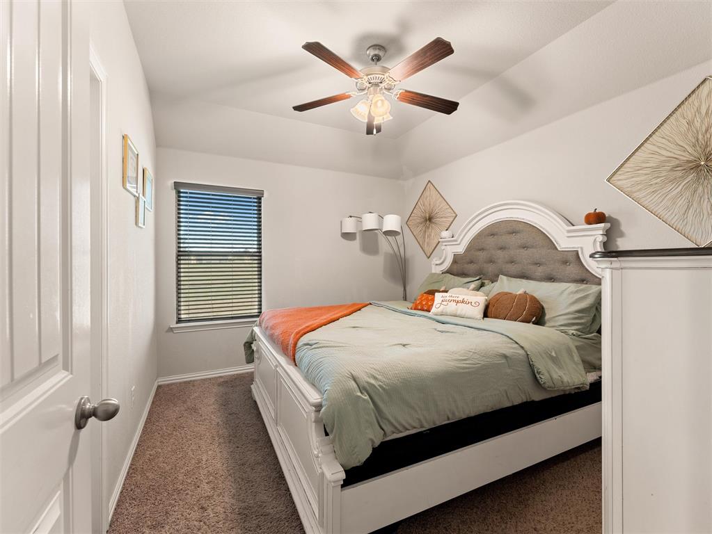 109 Highland Hills Boulevard Decatur, TX 76234 - Photo 25 of 36 a bedroom with a bed and window
