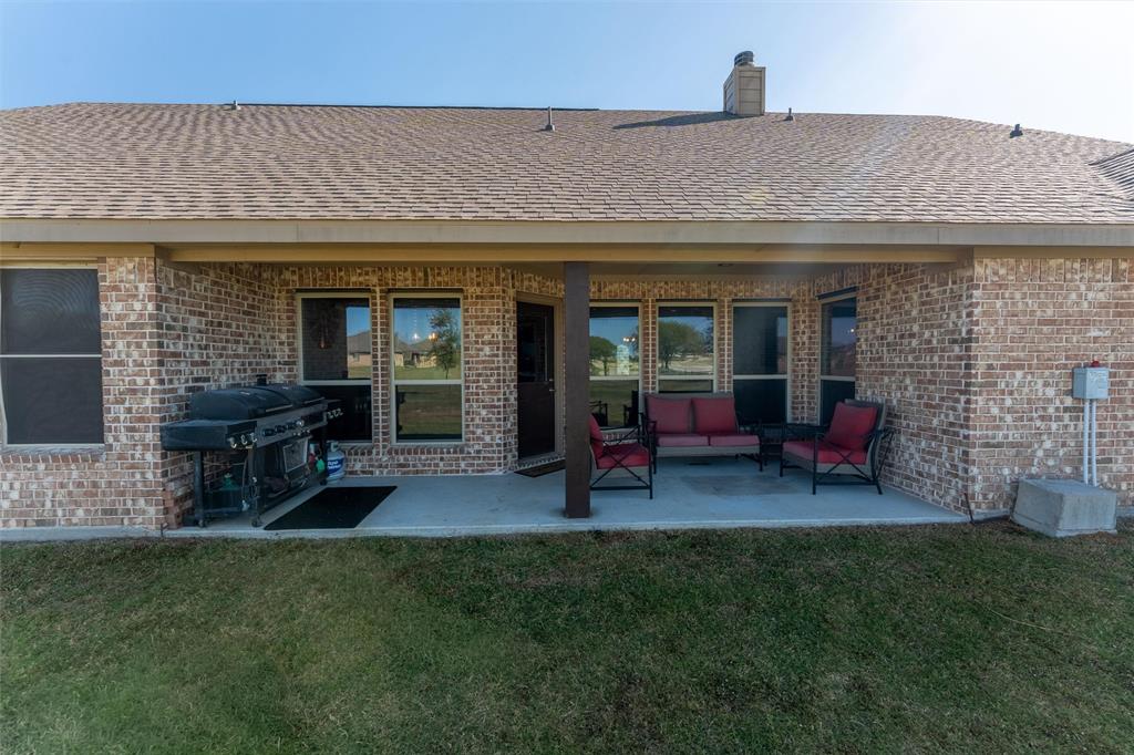 109 Highland Hills Boulevard Decatur, TX 76234 - Photo 30 of 36 a view of a house with backyard porch and sitting area
