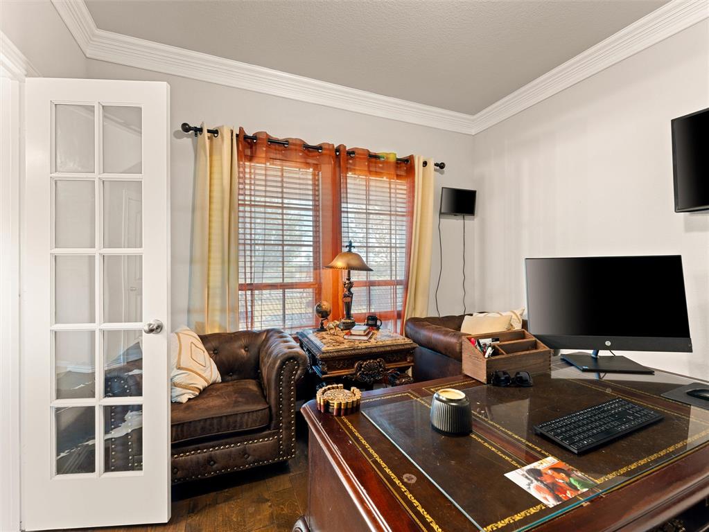 109 Highland Hills Boulevard Decatur, TX 76234 - Photo 7 of 36 a living room with furniture and a flat screen tv
