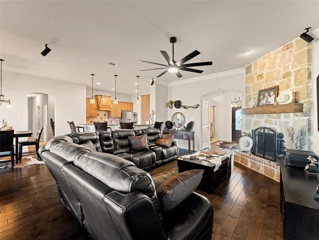 a living room with fireplace furniture and a fireplace