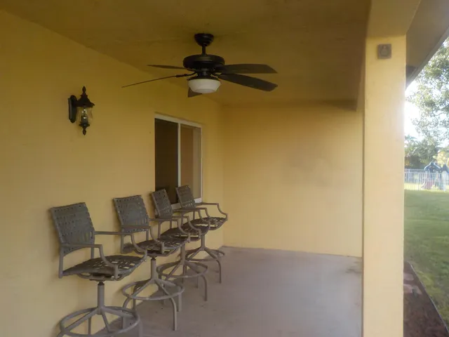 a view of a room with a table and a chair