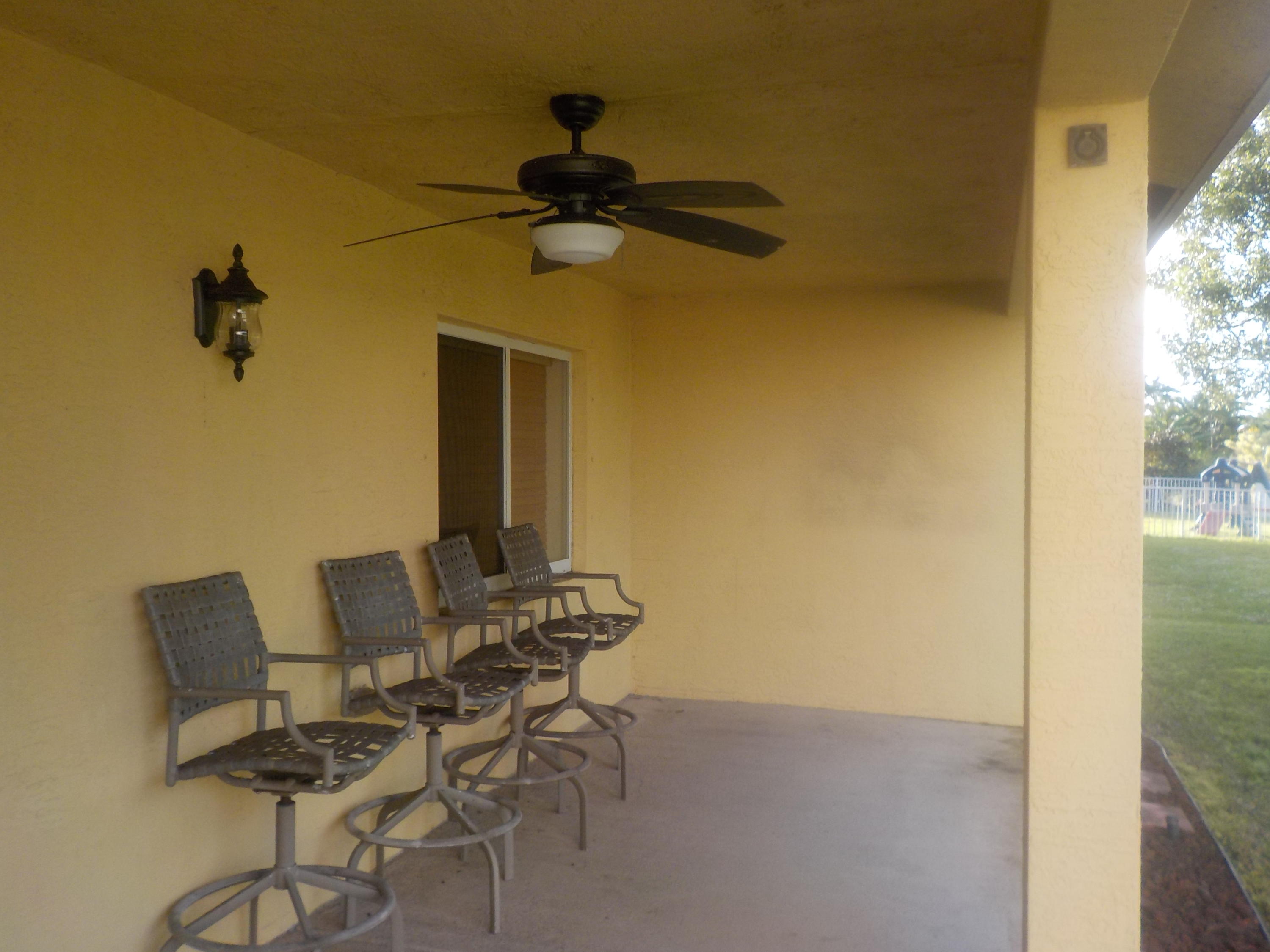 1957 Providence Place Port St. Lucie, FL 34953 - Photo 11 of 15 a view of a room with a table and a chair