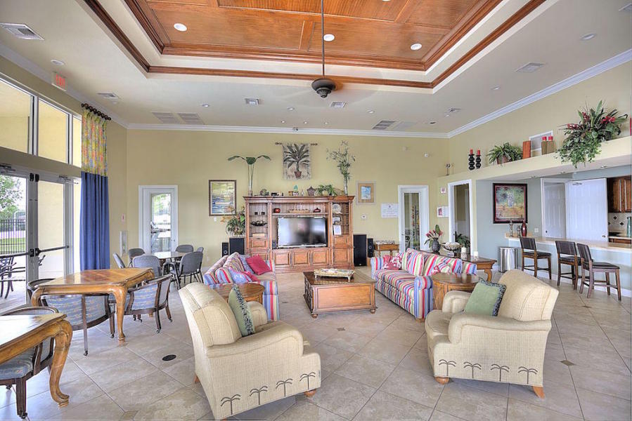 1957 Providence Place Port St. Lucie, FL 34953 - Photo 13 of 15 a living room with fireplace furniture and a large window
