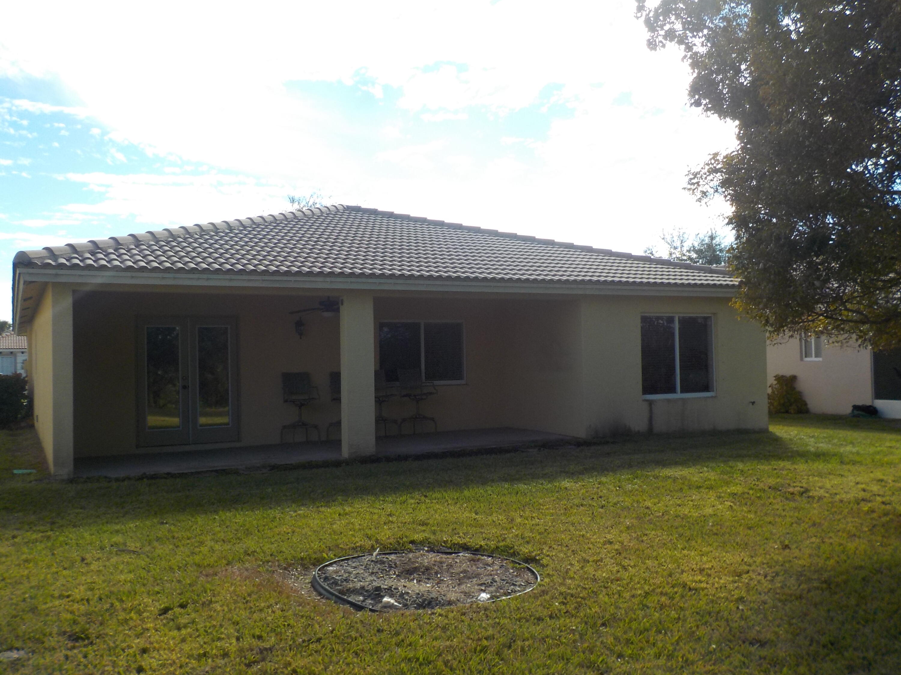 1957 Providence Place Port St. Lucie, FL 34953 - Photo 15 of 15 a view of a house with a yard