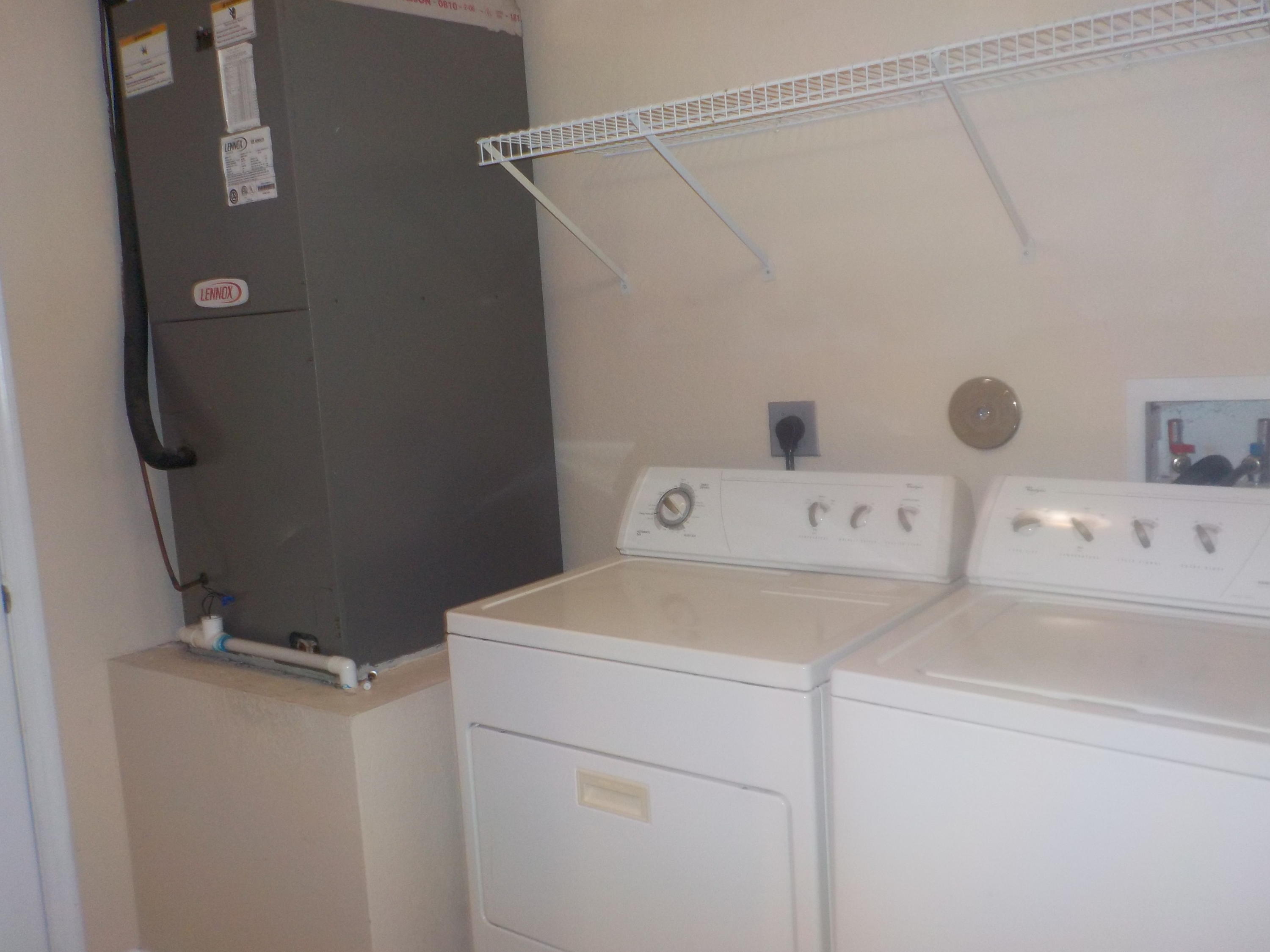 1957 Providence Place Port St. Lucie, FL 34953 - Photo 10 of 15 a utility room with dryer and washer