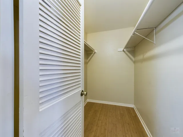 a bathroom with a sink and mirror with toilet