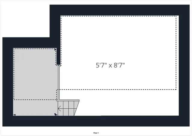 a picture of a bench in front of a wall