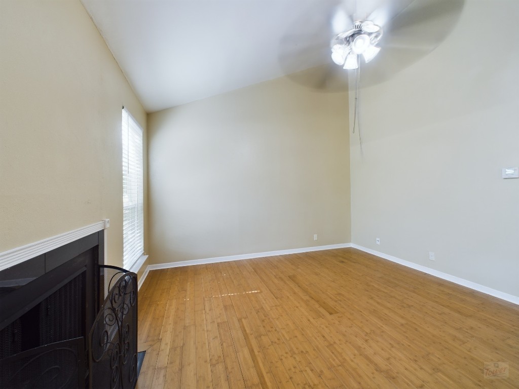 1000 West 26th Street, Unit 210 Austin, TX 78705 - Photo 3 of 19 wooden floor in an empty room