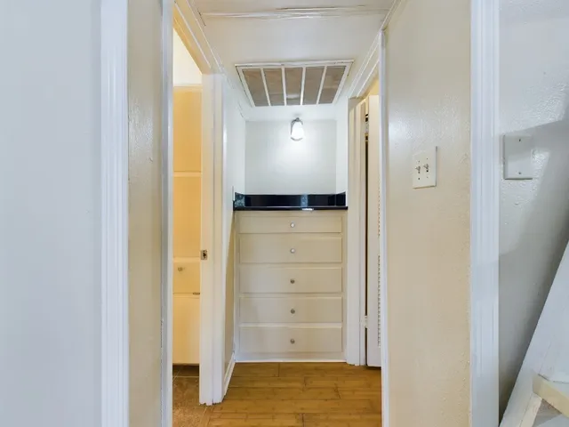 a view of a room with racks on the wall