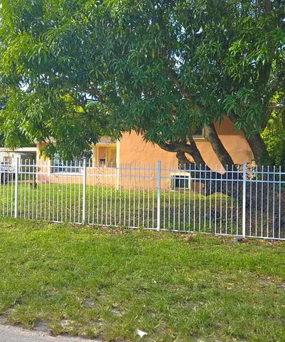a view of a small yard and a fountain