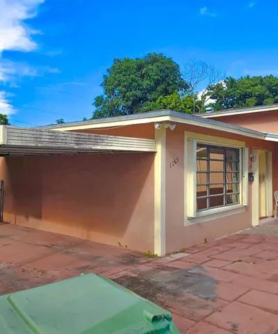 front view of a house with a yard