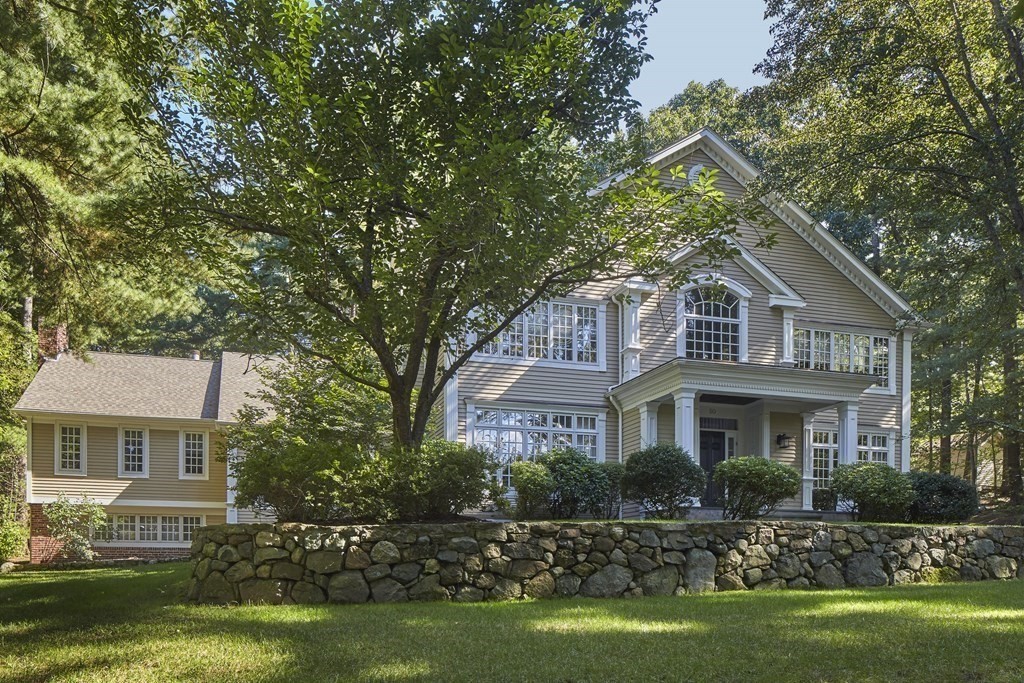 50 Fairview Road Weston, MA 02493 - Photo 1 of 28 a front view of a house with a garden