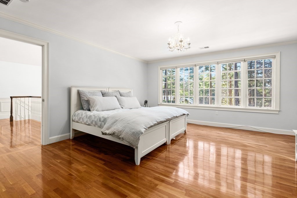 50 Fairview Road Weston, MA 02493 - Photo 23 of 28 a spacious bedroom with a bed and a large window