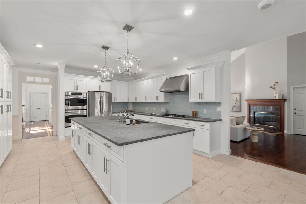 50 Fairview Road Weston, MA 02493 - Photo 10 of 28 a large kitchen with kitchen island a sink counter space stainless steel appliances and a center island