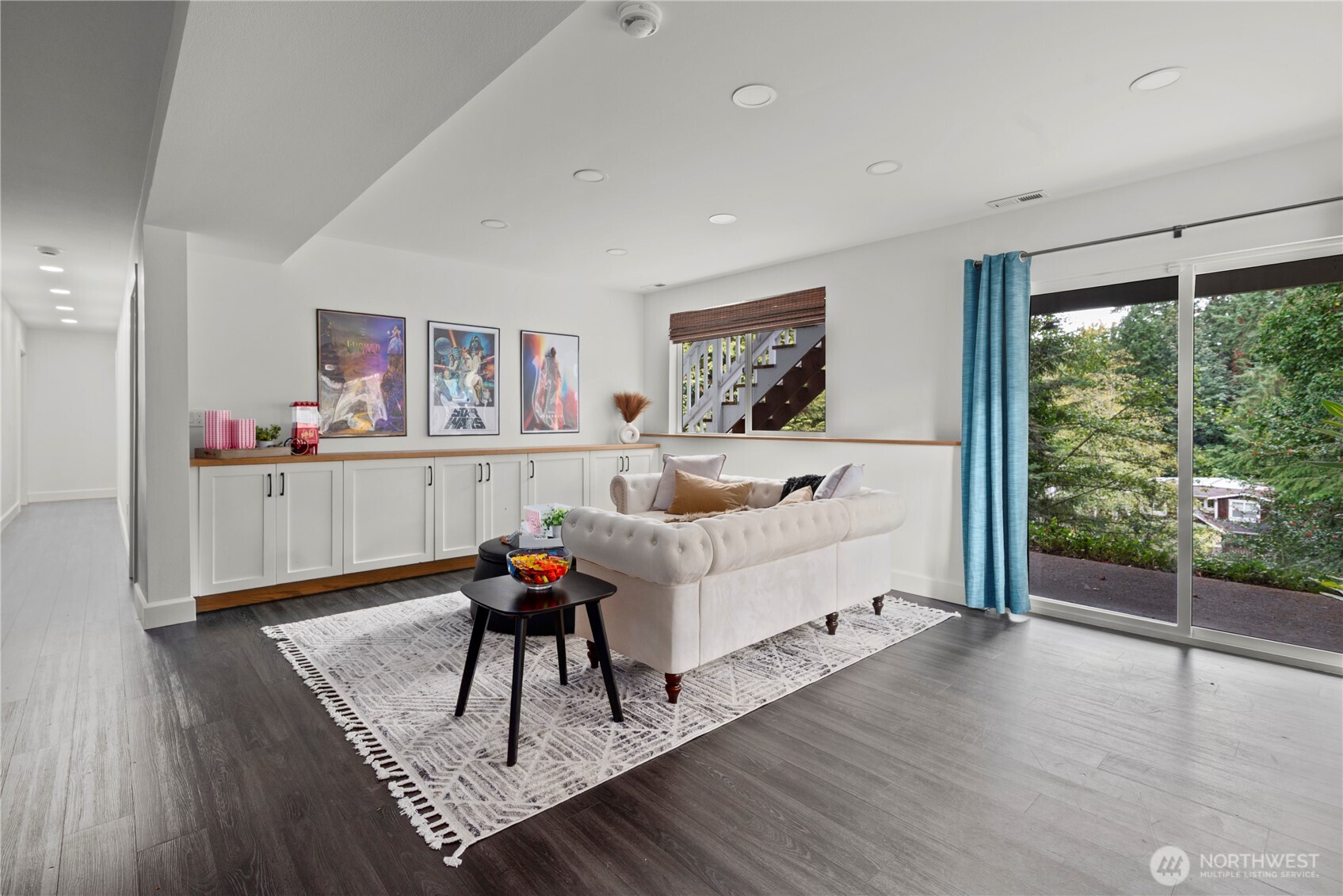 8732 209th Place Southwest Edmonds, WA 98026 - Photo 19 of 39 a living room with furniture and a book shelf