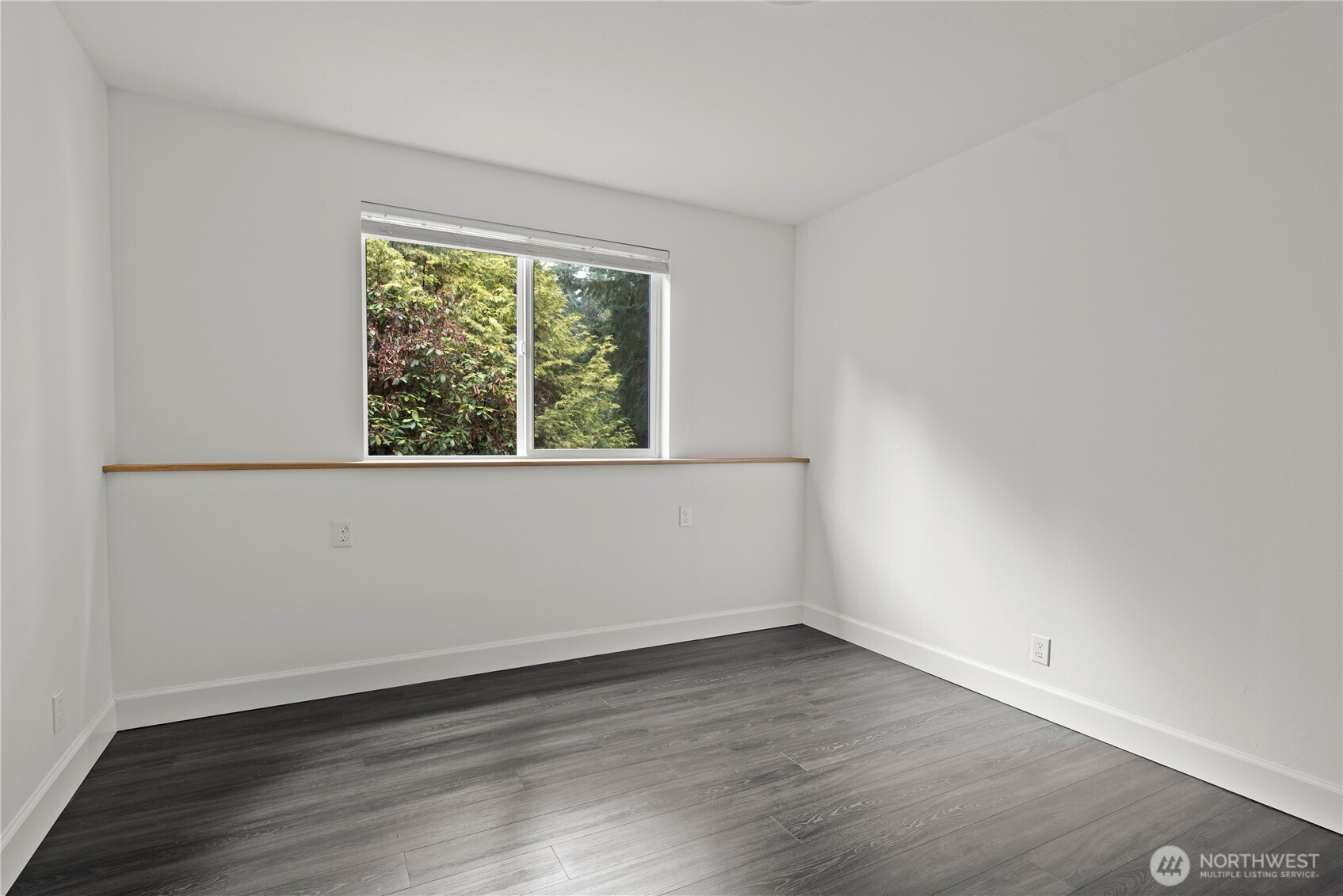 8732 209th Place Southwest Edmonds, WA 98026 - Photo 24 of 39 an empty room with wooden floor and window